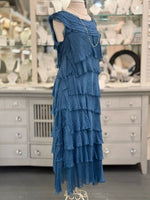 Side view of the Briella Layered Silk Dress in Prussian blue, made in Italy with flowing washable silk tiers.