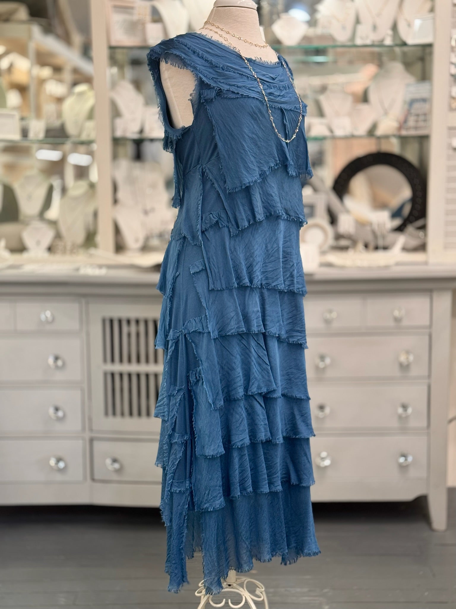 Side view of the Briella Layered Silk Dress in Prussian blue, made in Italy with flowing washable silk tiers.