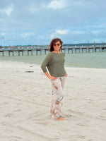 Brielle in Olive outfit on sand in Pensacola Beach FL