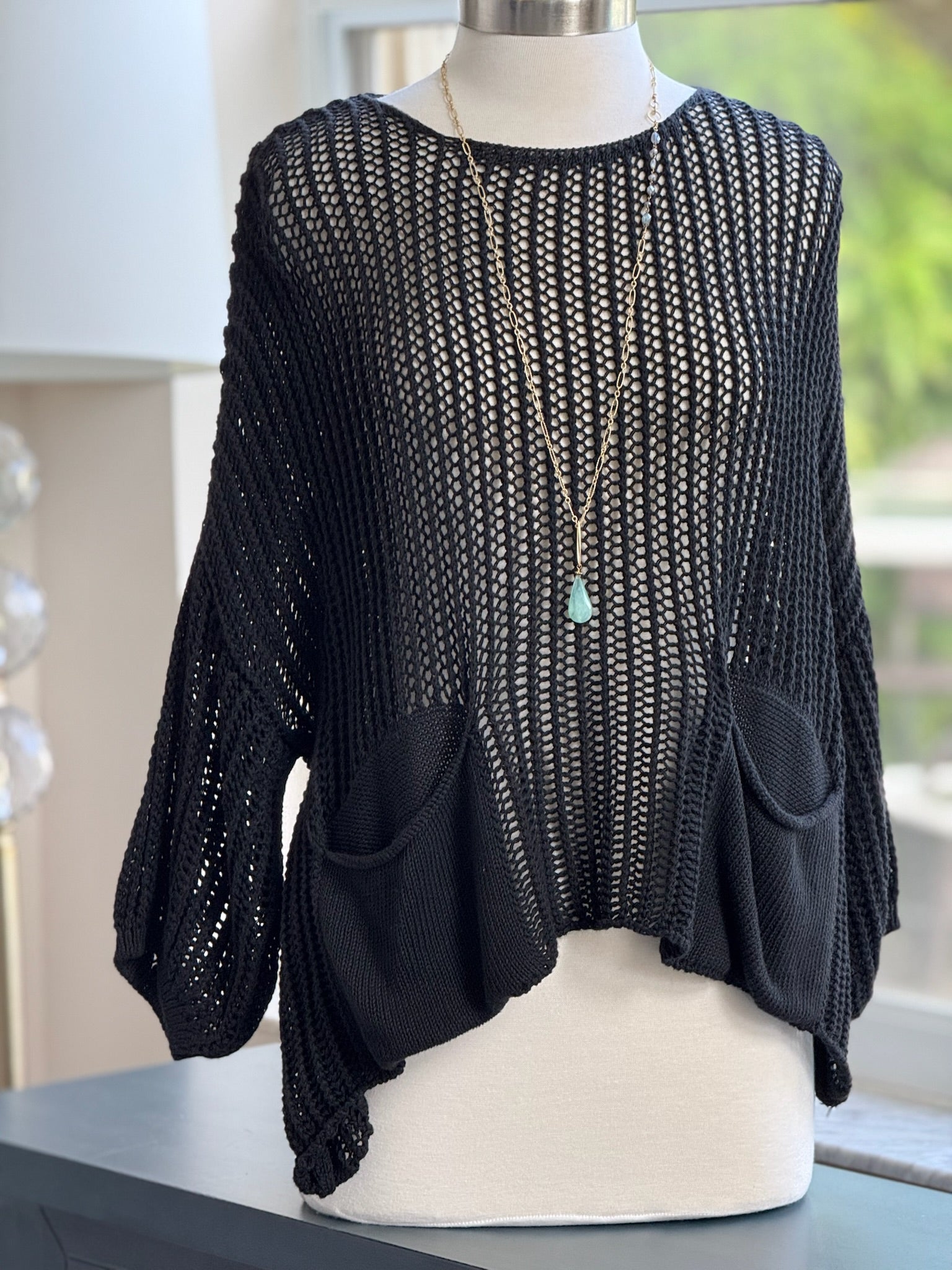 Cecilia crochet sweater in black shown on mannequin front view 