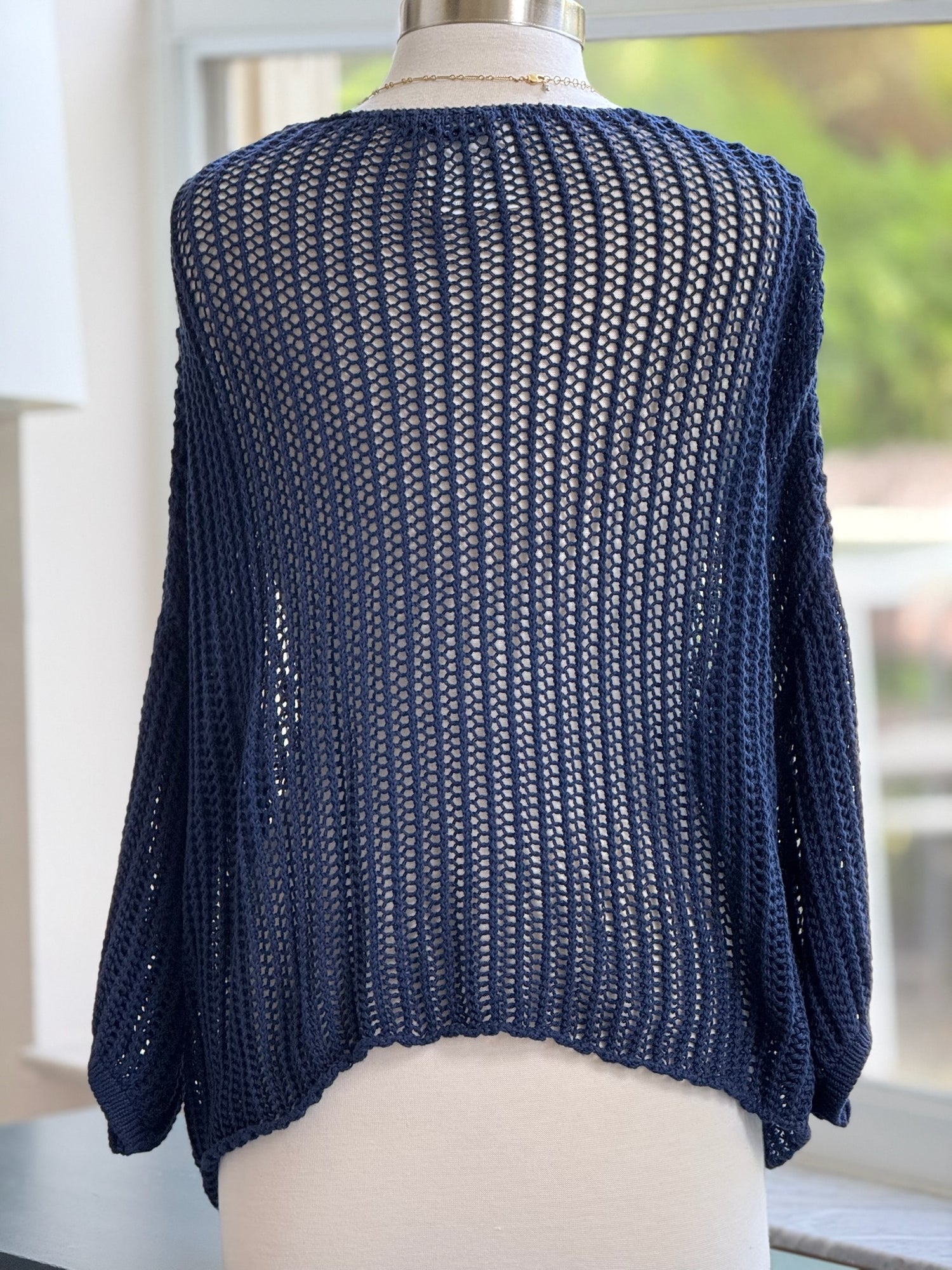 Cecilia crochet sweater shown on mannequin back view