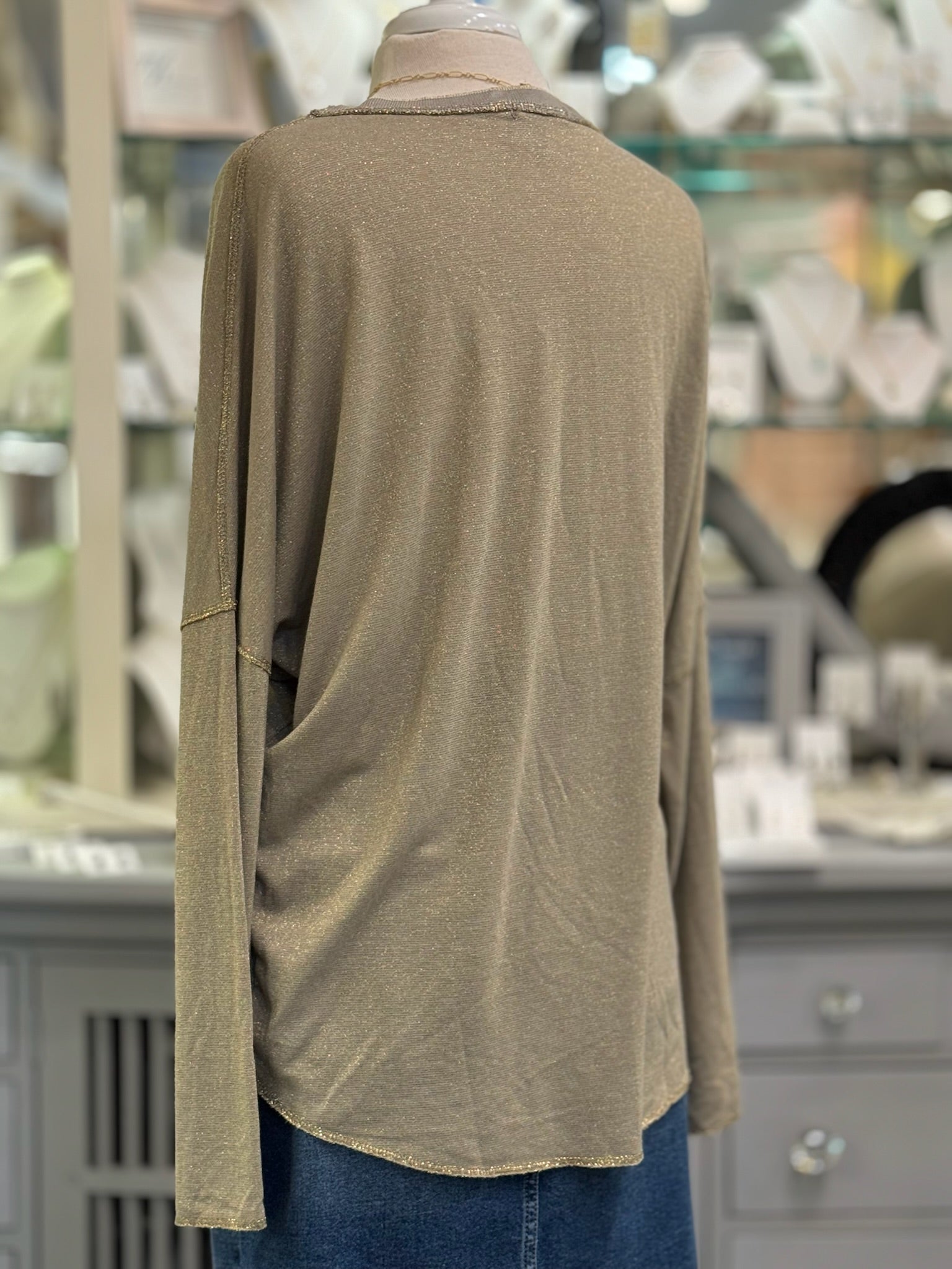 Back view of the Celeste Top in mocha, highlighting the relaxed fit, lightweight drape, and subtle shimmer throughout the fabric.