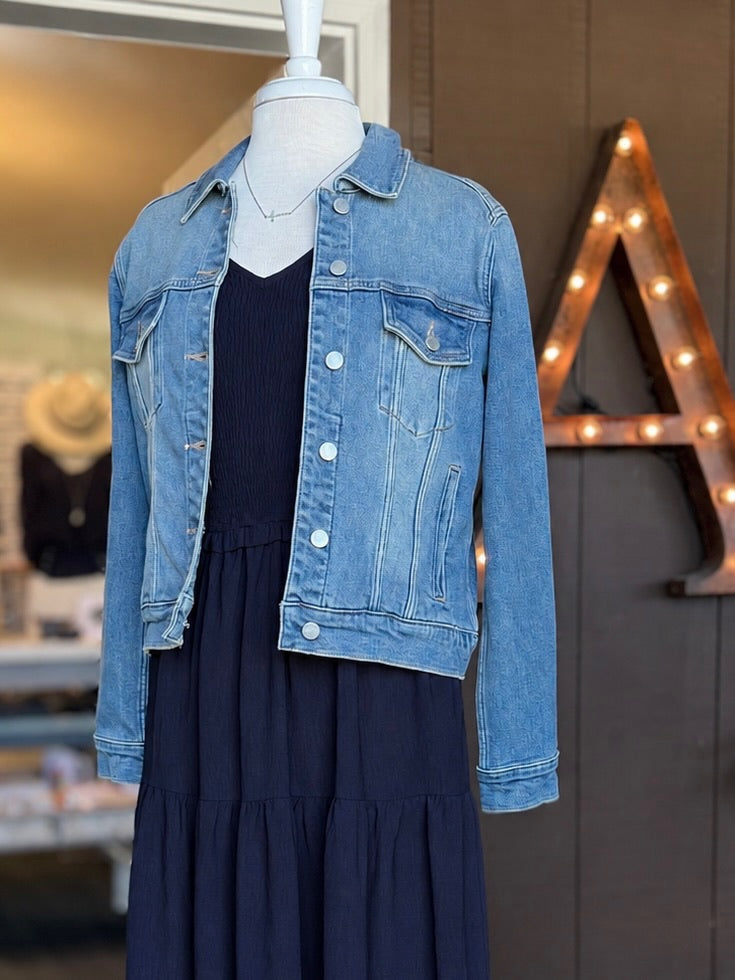 Macy Denim Jacket in medium wash layered over the navy Everly Dress with a delicate necklace at Ardor Boutique.