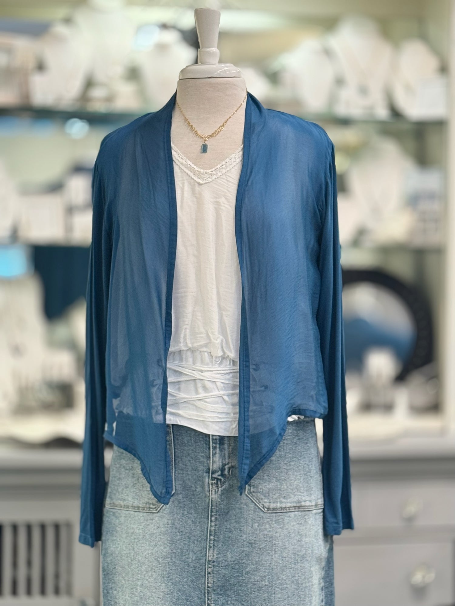 Chloe silk cardigan open front in Prussian Blue over white blouse and denim bottoms