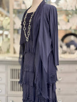 Side view of the Clara Silk Cardigan in navy, made in Italy with a soft layered drape and open-front design.