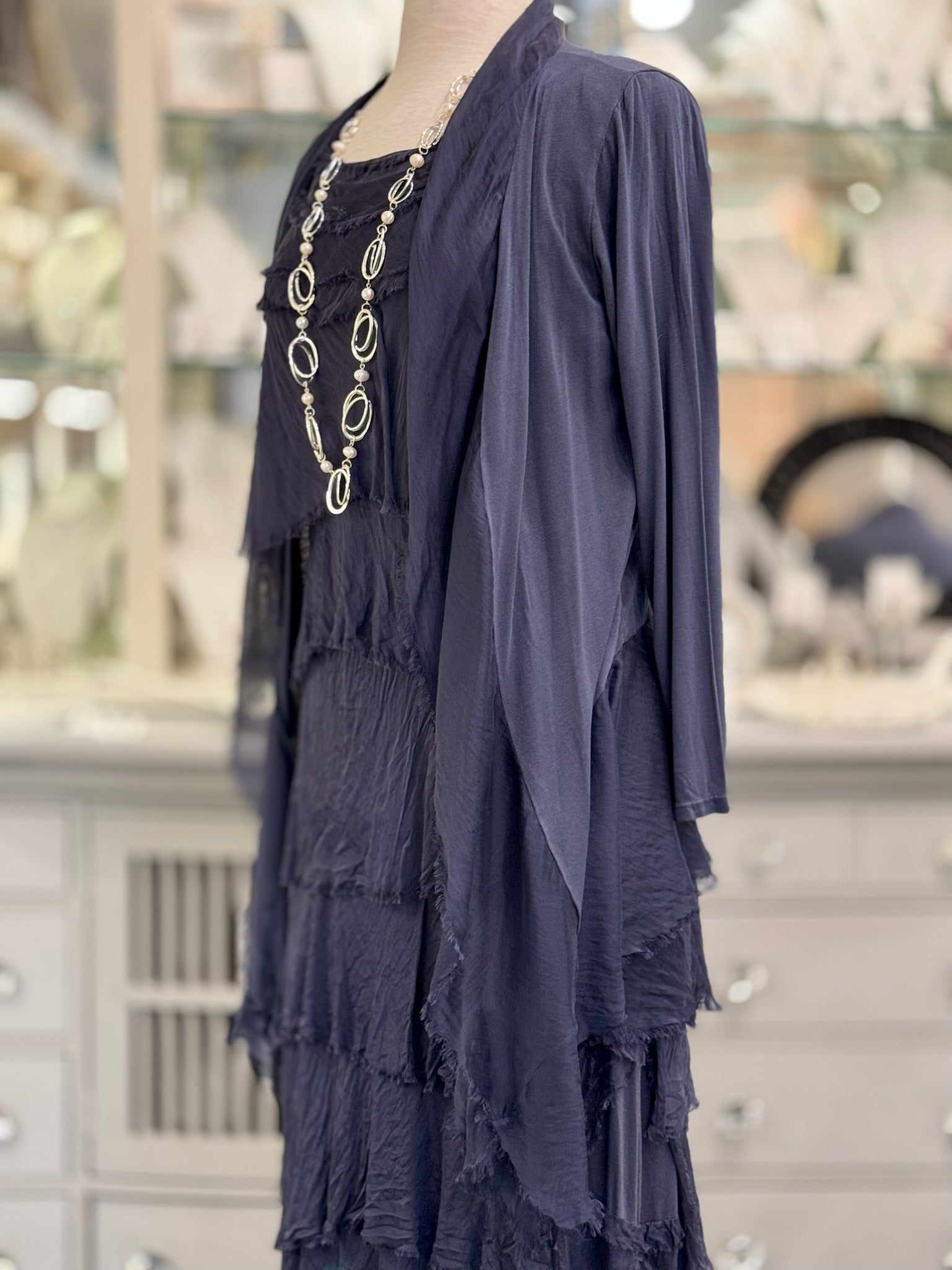 Side view of the Clara Silk Cardigan in navy, made in Italy with a soft layered drape and open-front design.