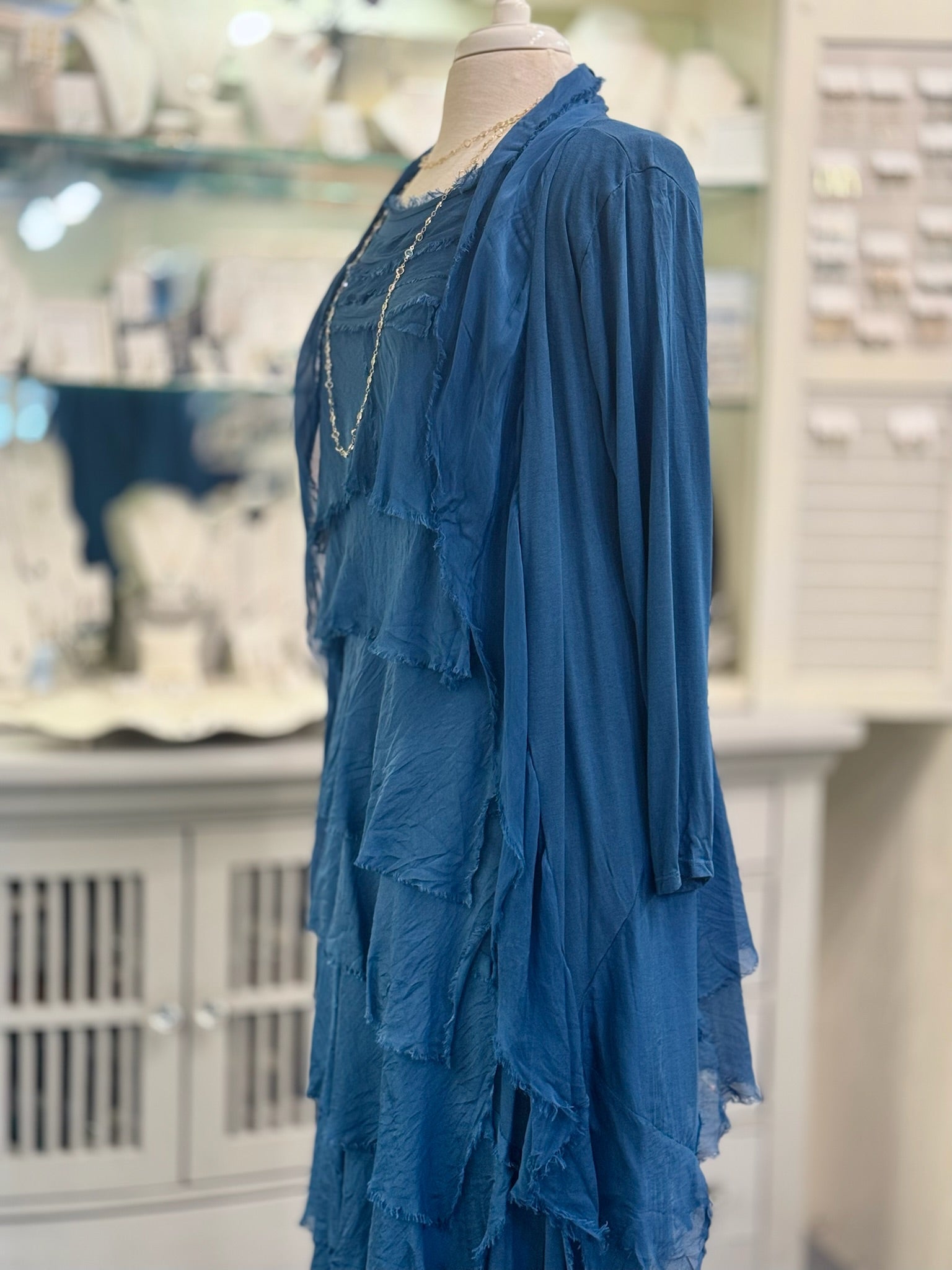 Side view of the Clara Silk Cardigan in Prussian blue, made in Italy with a soft layered drape and open-front design.