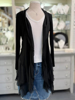 Clara Cardigan in black featuring long sleeves, a cascading open front, raw-edge detailing, and an asymmetrical hem, displayed at Ardor Boutique.