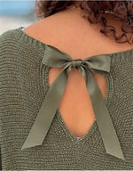 Close-up of the Briella olive sweater’s ribbon bow and back opening, showing the shimmering knit texture.