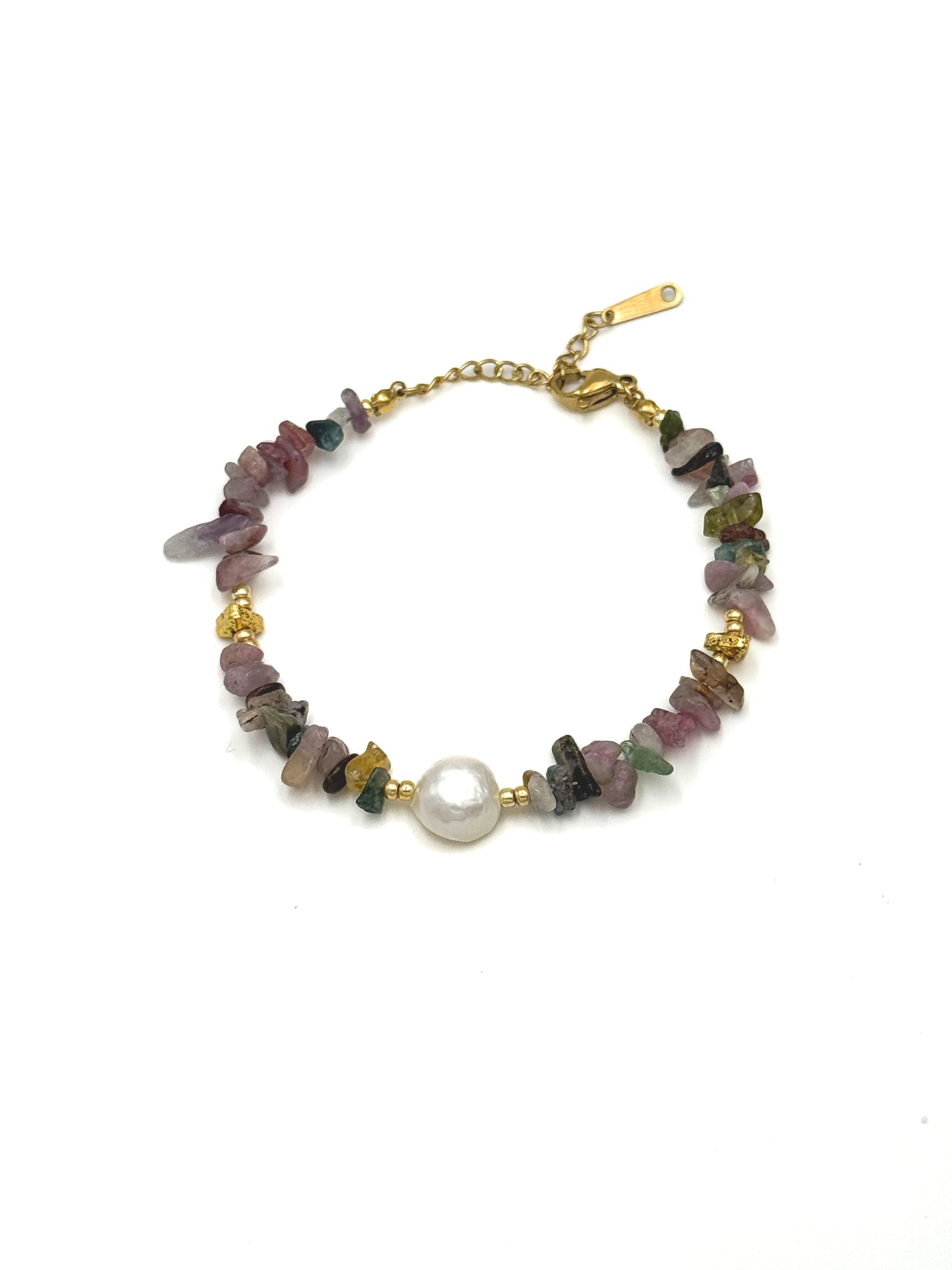 Close-up of the Mira Tourmaline & Freshwater Pearl Bracelet with multicolor tourmaline chips and a single round freshwater pearl on a gold-tone chain at Ardor Boutique.