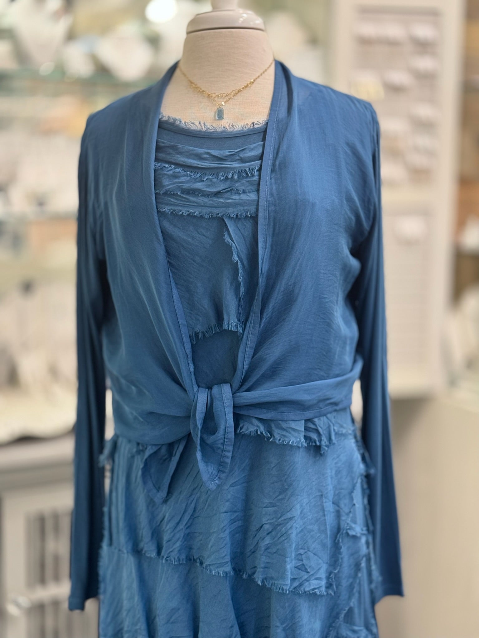 Close up of Chloe cardigan paired over the Briella dress in Prussian Blue