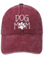 Front view of Dog Mom Cap in burgundy red with white embroidered lettering and paw print.