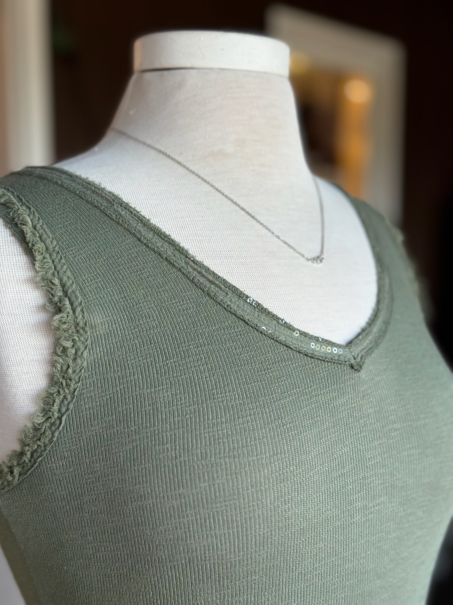 Sequin and rough edge detail on Elisa Tank in olive