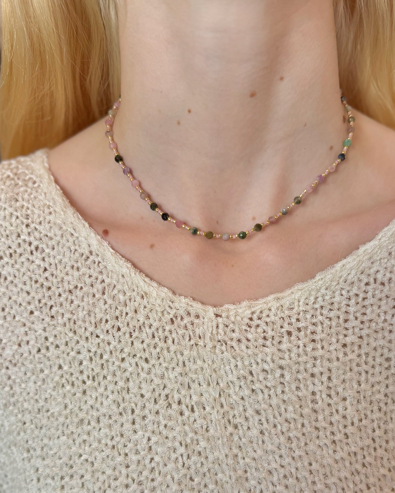 Esme Tourmaline Handmade Necklace on model wearing creme top