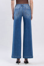 Back view of The Fallon Jean showcasing classic wide leg and trouser hem