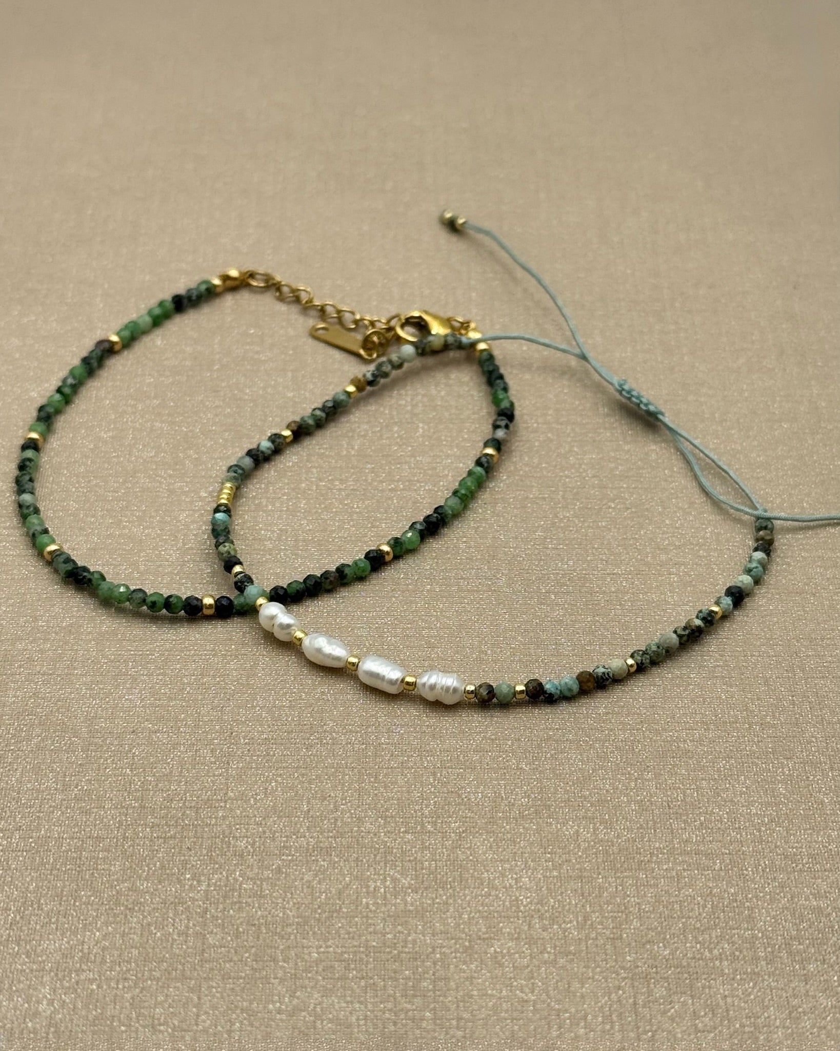 Flat lay of Nora Epidote Beaded Bracelet And Amina Bracelet
