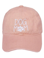 Front view of Dog Mom Cap in pink with white embroidered lettering and paw print.
