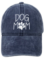 Front view of Dog Mom Cap in navy with white embroidered lettering and paw print.