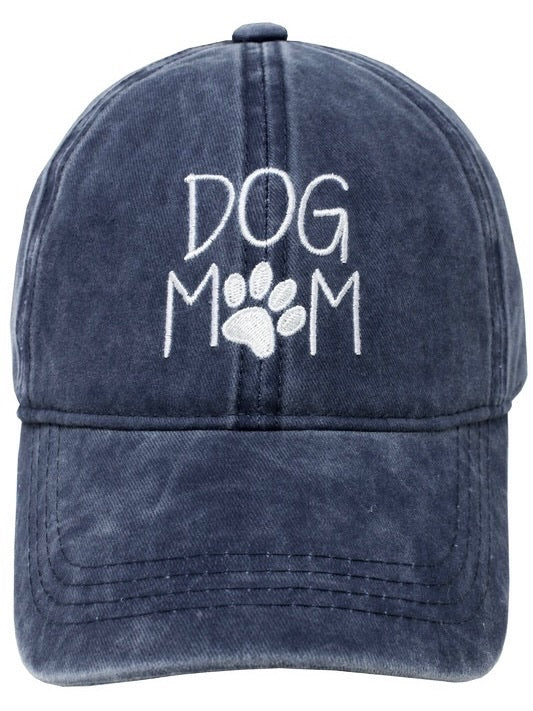 Front view of Dog Mom Cap in navy with white embroidered lettering and paw print.