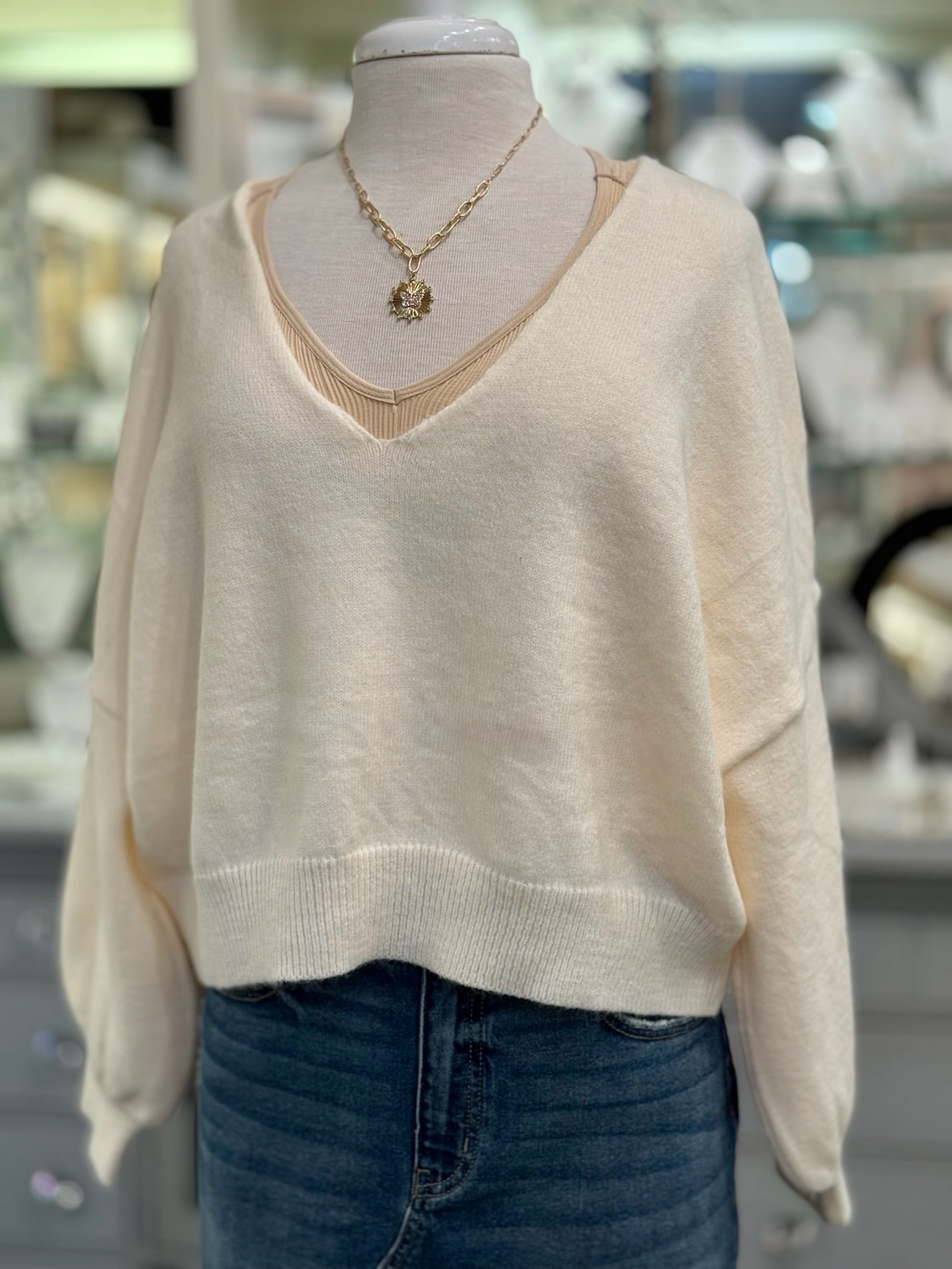 Front view of Ren Reversible Cropped Sweater in cream with V neckline.