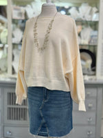 Front view of Ren Reversible Cropped Sweater in cream with crew neckline.