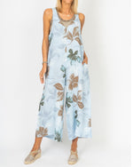 Front view of the Sienna Leaf Print Linen Romper in Blue on model