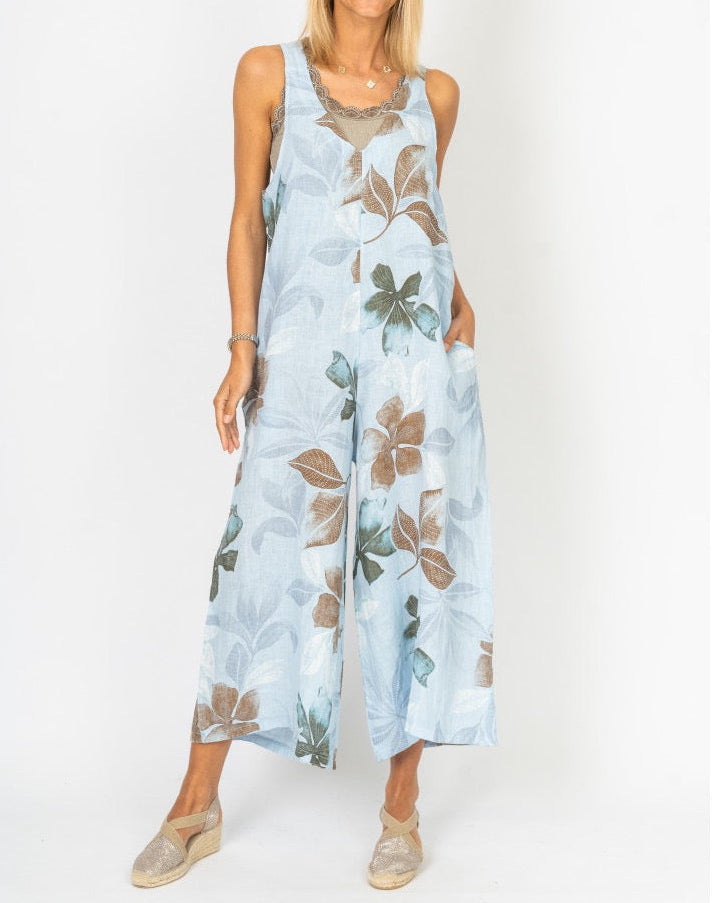 Front view of the Sienna Leaf Print Linen Romper in Blue on model