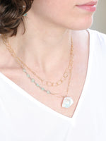 Front view showing 2 necklaces layered using layering clasp