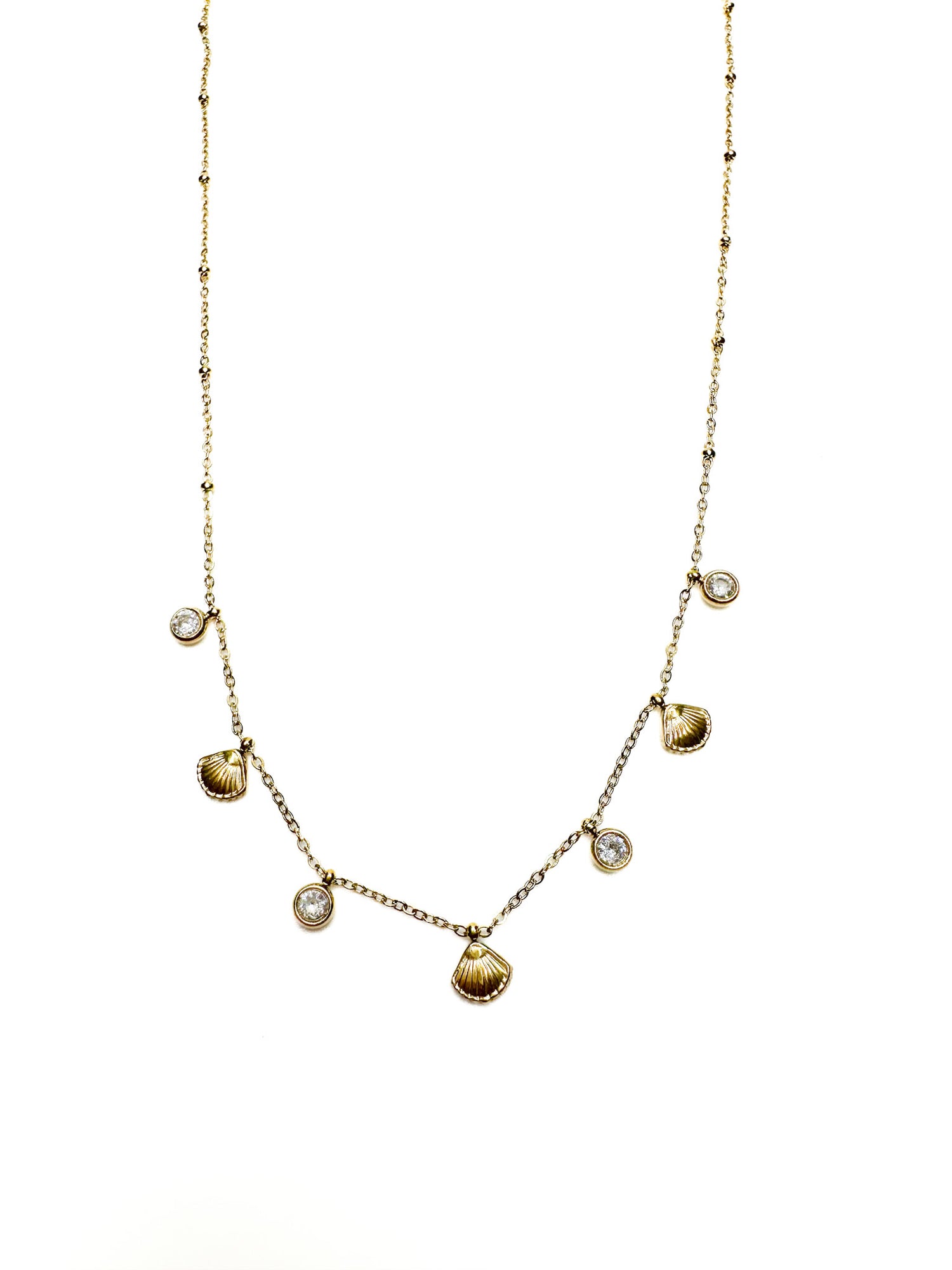 Gold necklace with heart-shaped pendants on a white background