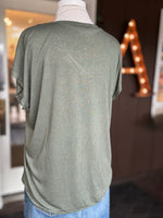 Back view of the Grace Batwing Short Sleeve Top in olive showing its soft drape, batwing sleeves and subtle silver trim at Ardor Boutique.