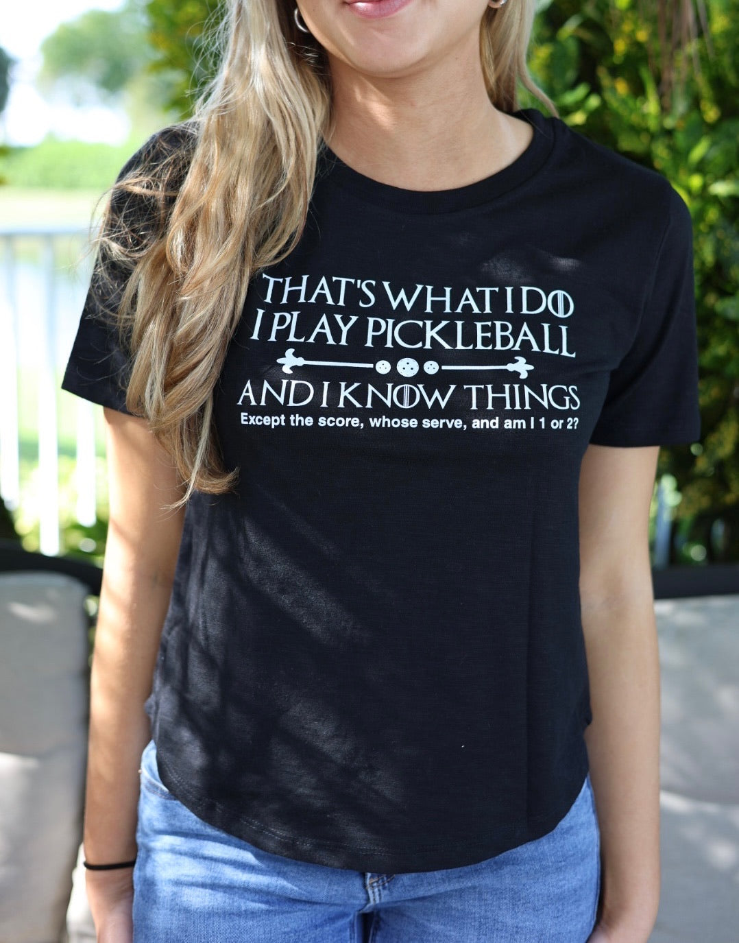 women wearing black pickle ball shirt 