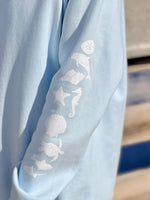 Light blue fabric with white sea-themed sleeve