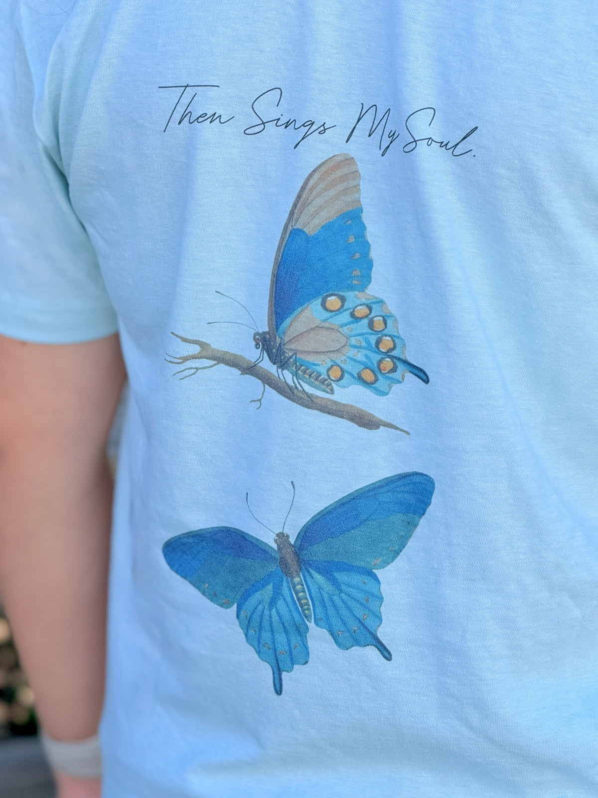 Sea Mist t-shirt with butterfly design and text 'Then Sings My Soul'.
