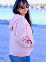 pink watercolor butterfly sleeve hoodie on a women