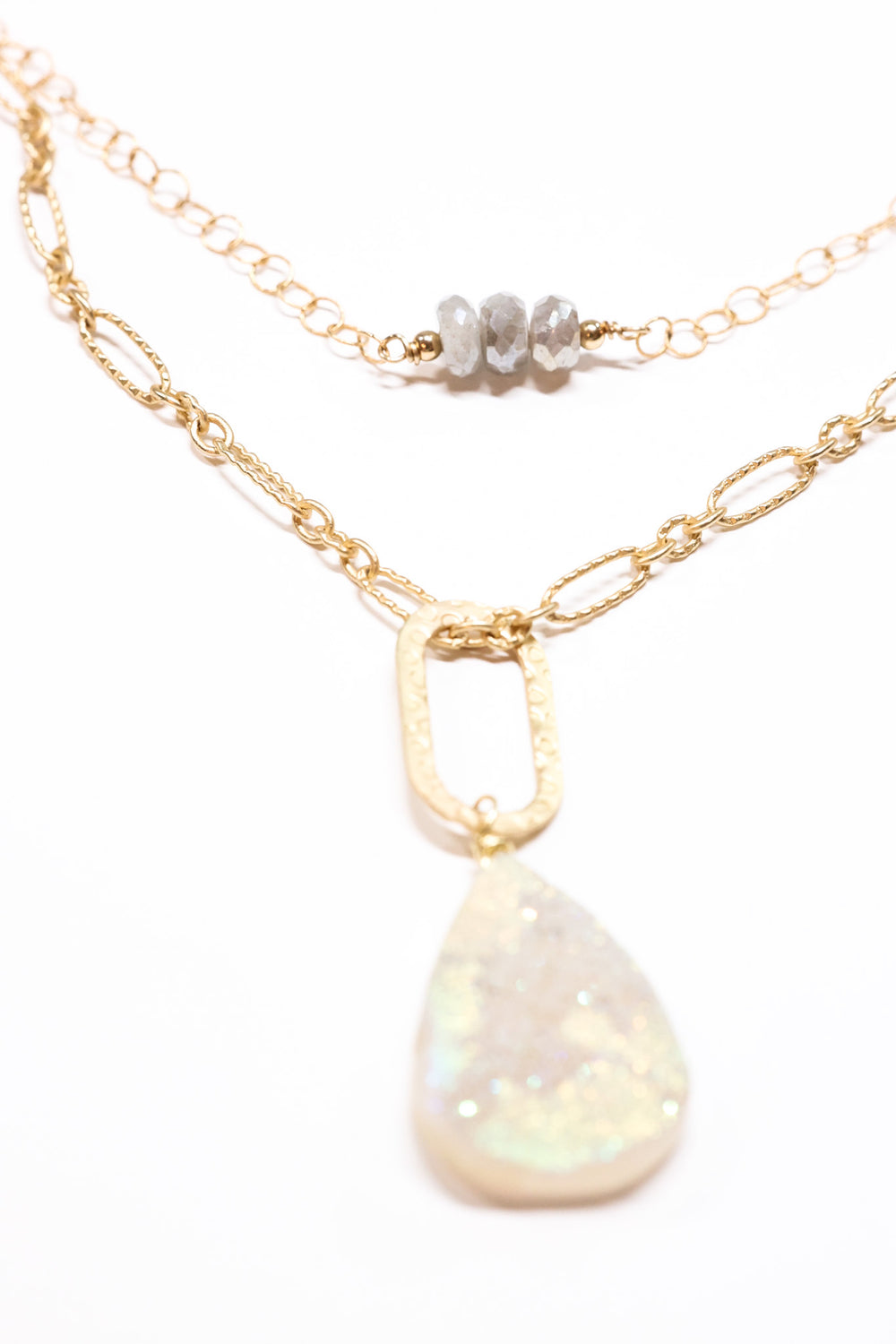 Drusy necklace shown layered with shorter necklace