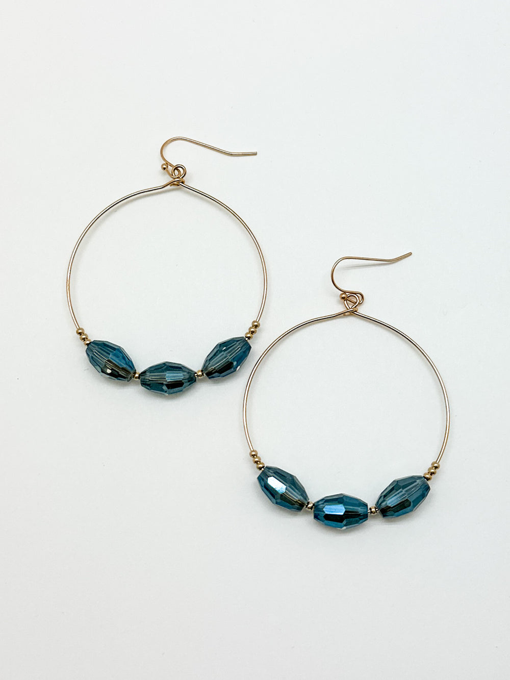 3 Blue Beaded Hoop Earrings. Gold hoop earrings with blue beads.