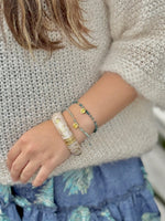 Gold floral cloisonné bracelet detail close-up"