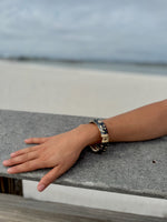 "Gold floral cloisonné bracelet detail close-up"