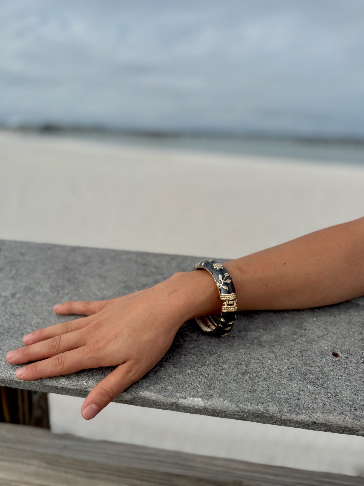 "Gold floral cloisonné bracelet detail close-up"