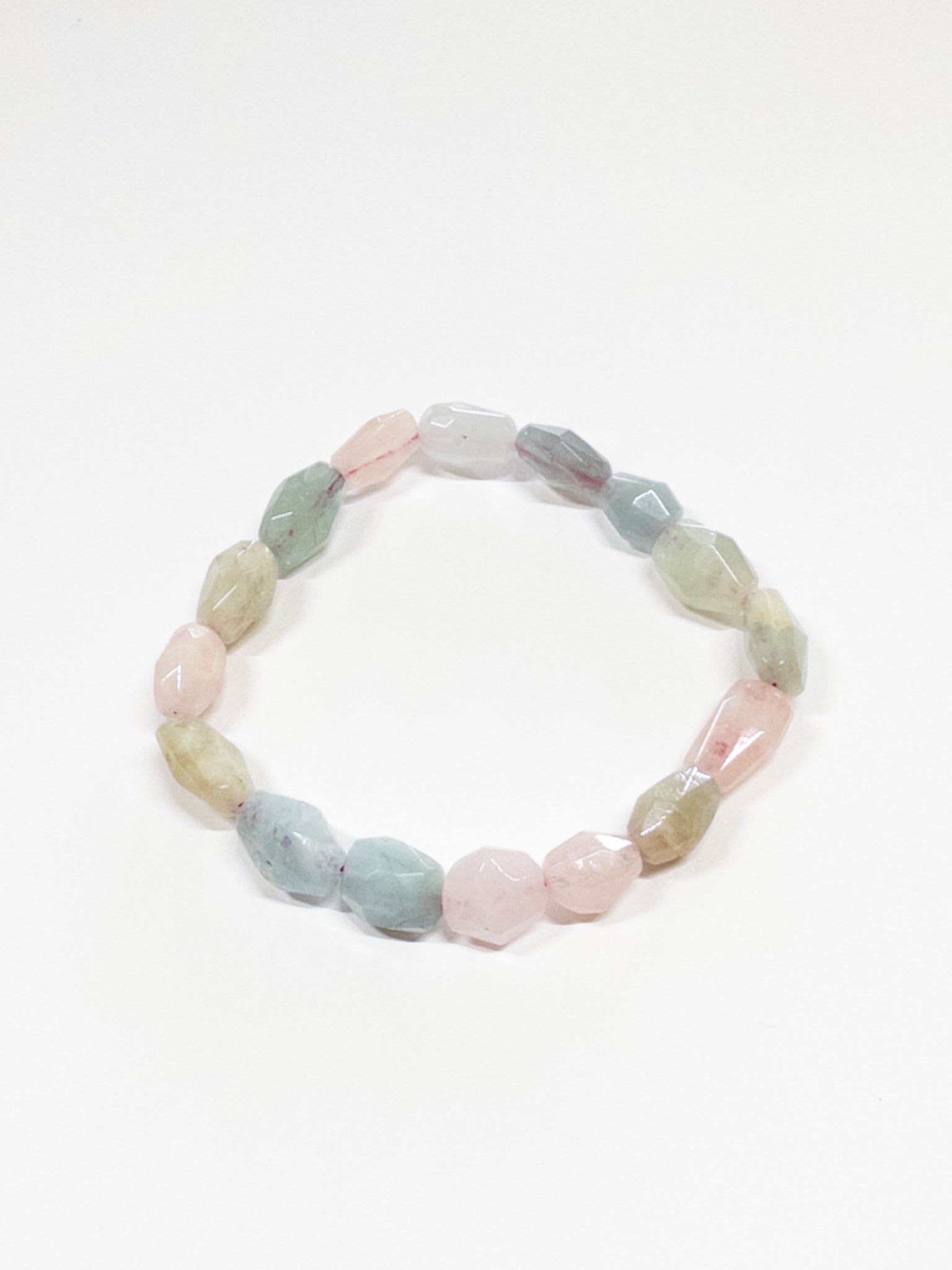A beaded bracelet with Morganite stones, displayed against a plain background.
