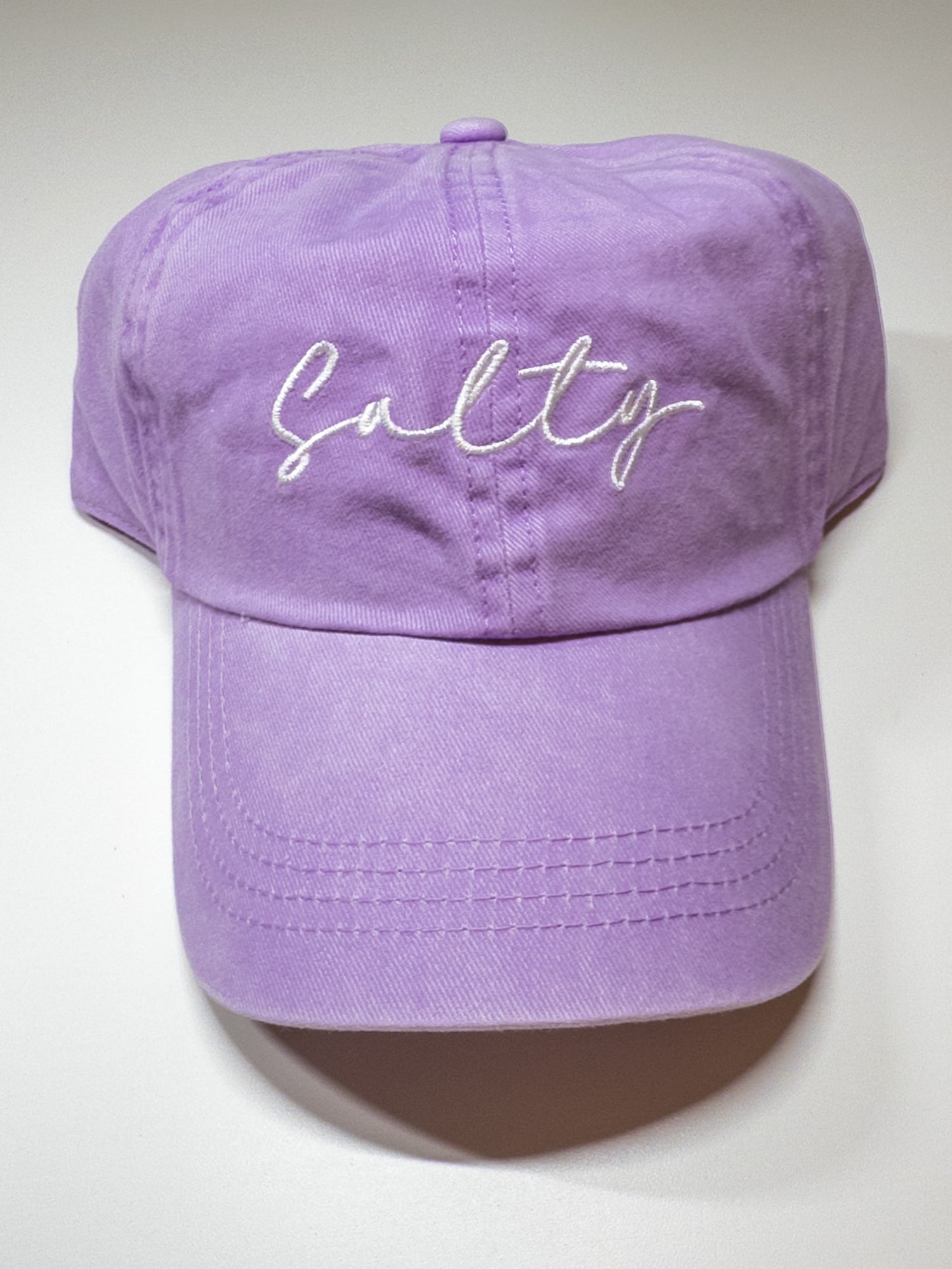 Purple cap with 'Salty' embroidery on a white background