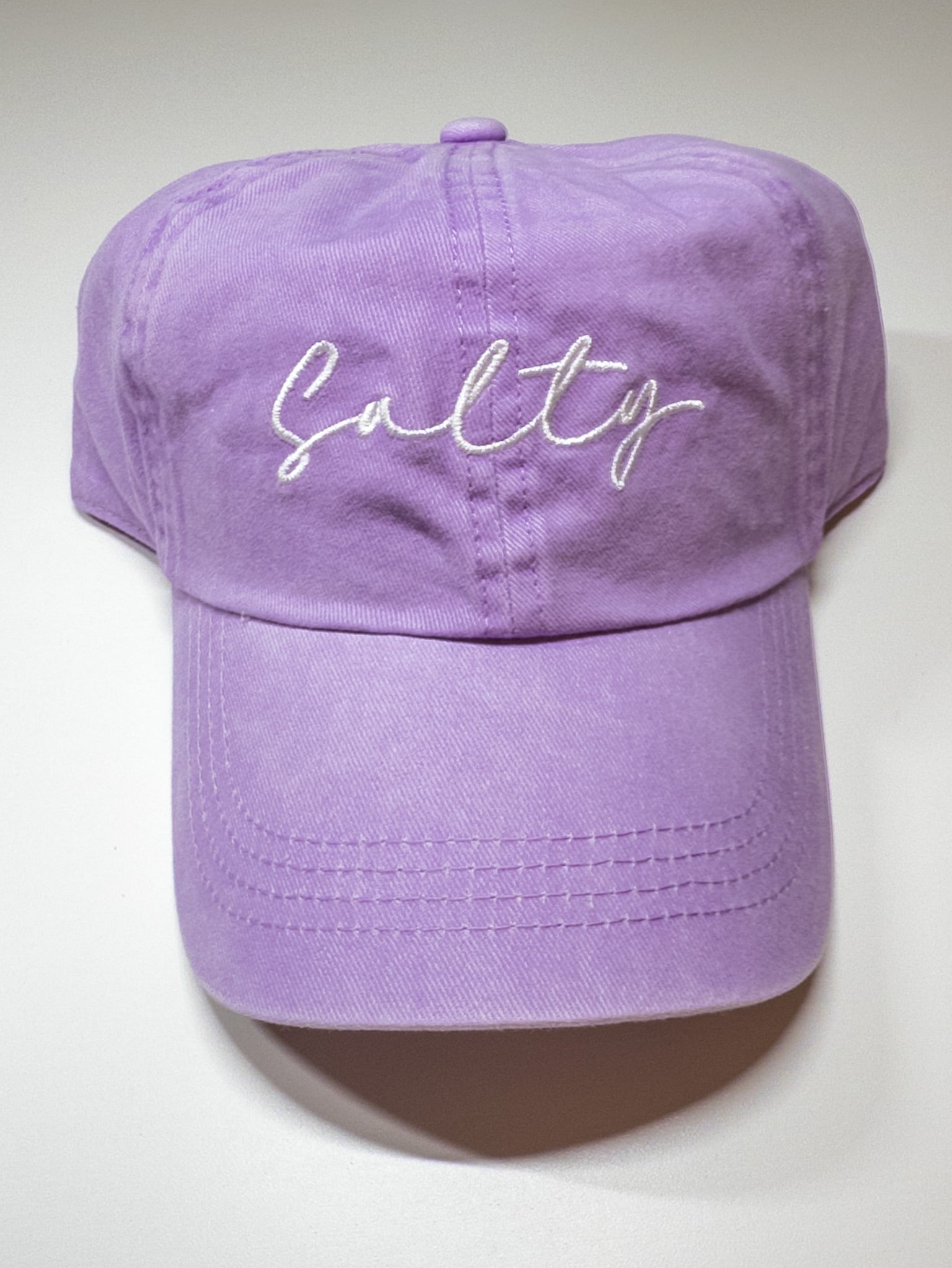 Purple cap with 'Salty' embroidery on a white background