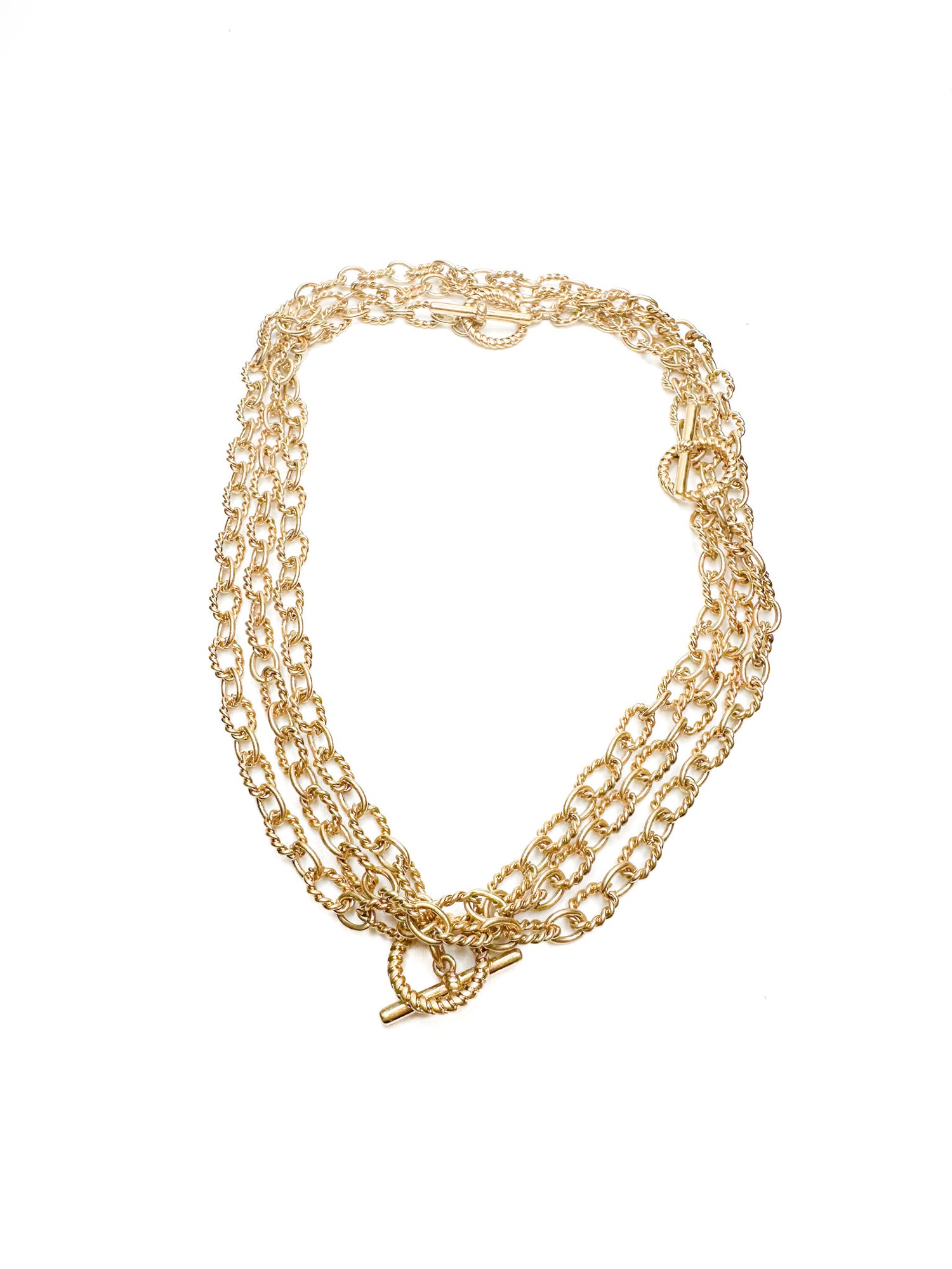 Gold chain necklace on a white background