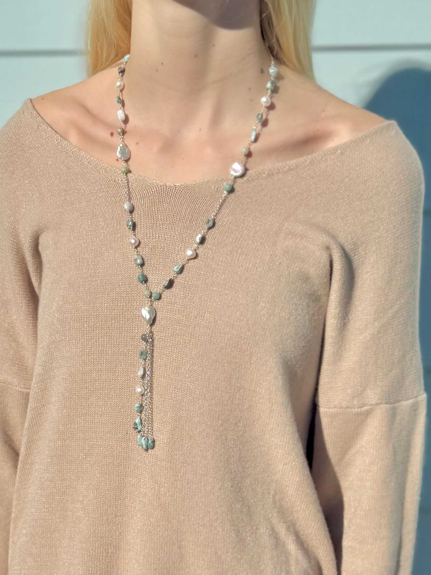 Colette amazonite and freshwater pearl necklace being worn with a beige sweater