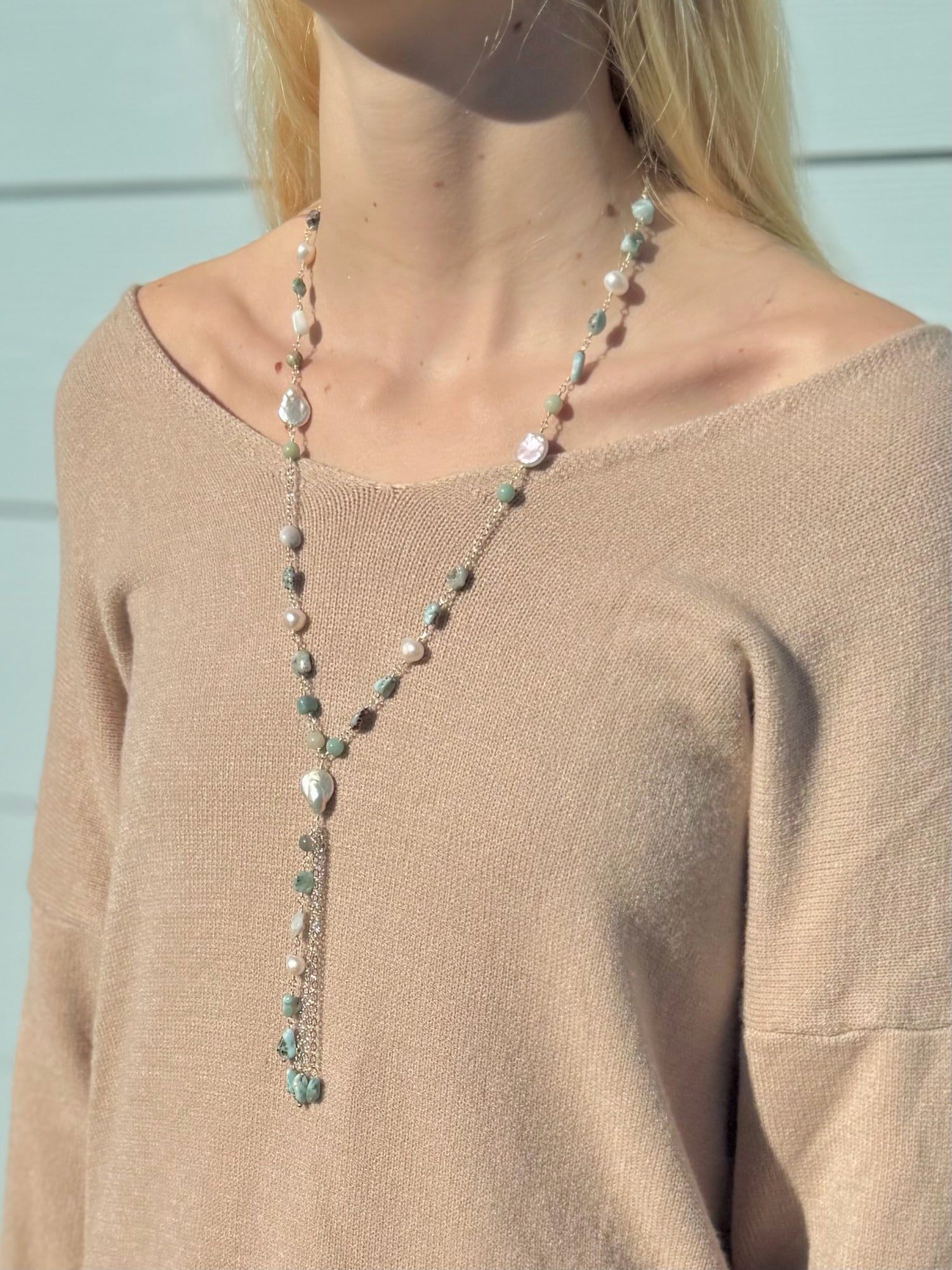 Colette amazonite and freshwater pearl necklace being worn with a beige sweater