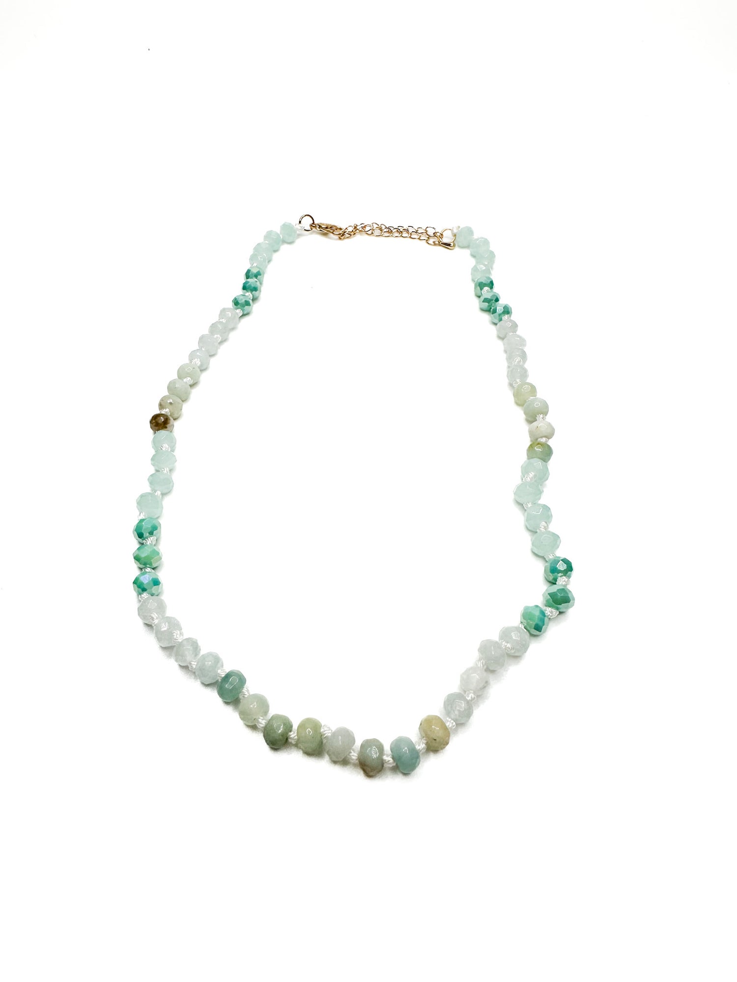 Necklace with multicolored beads on a white background