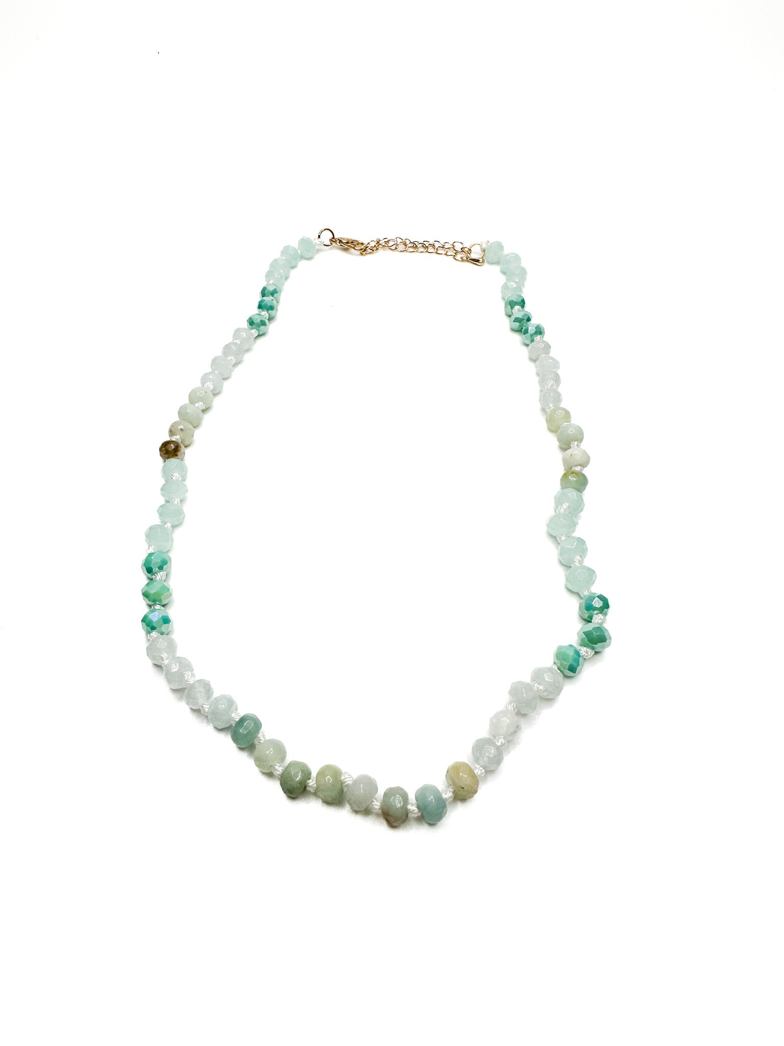 Necklace with multicolored beads on a white background