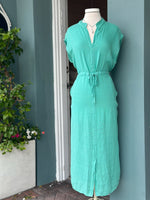 
Sharon Dress in turquoise teal linen with adjustable drawstring waist, split neckline, cap sleeves, midi length, and side pockets, made in Italy.