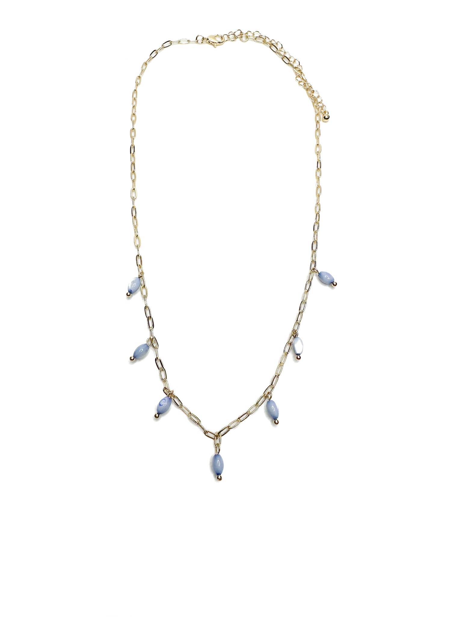 Gold necklace with small lavender drop beads evenly spaced along the front, laid flat on white background