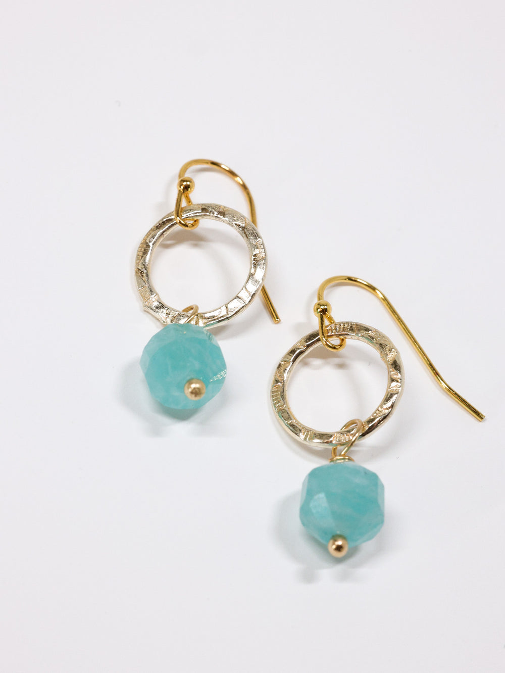 Mid length faceted amazonite earrings flat lay